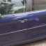 Scuff and dents on the side of blue Citroen Picasso