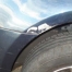 Close-up of dent repair on blue VW Golf